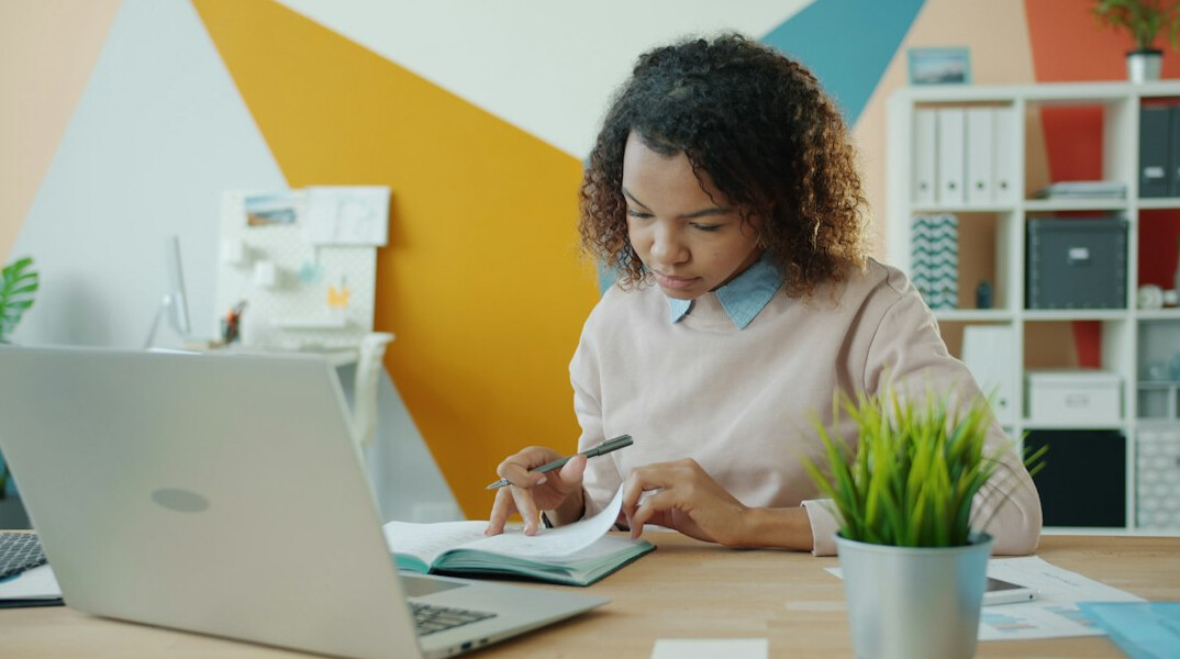 person reviewing bills at home desk