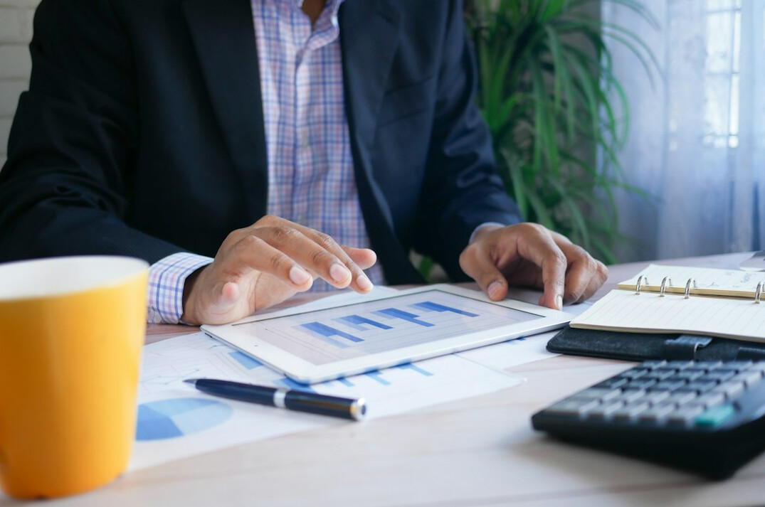 person organizing financial papers