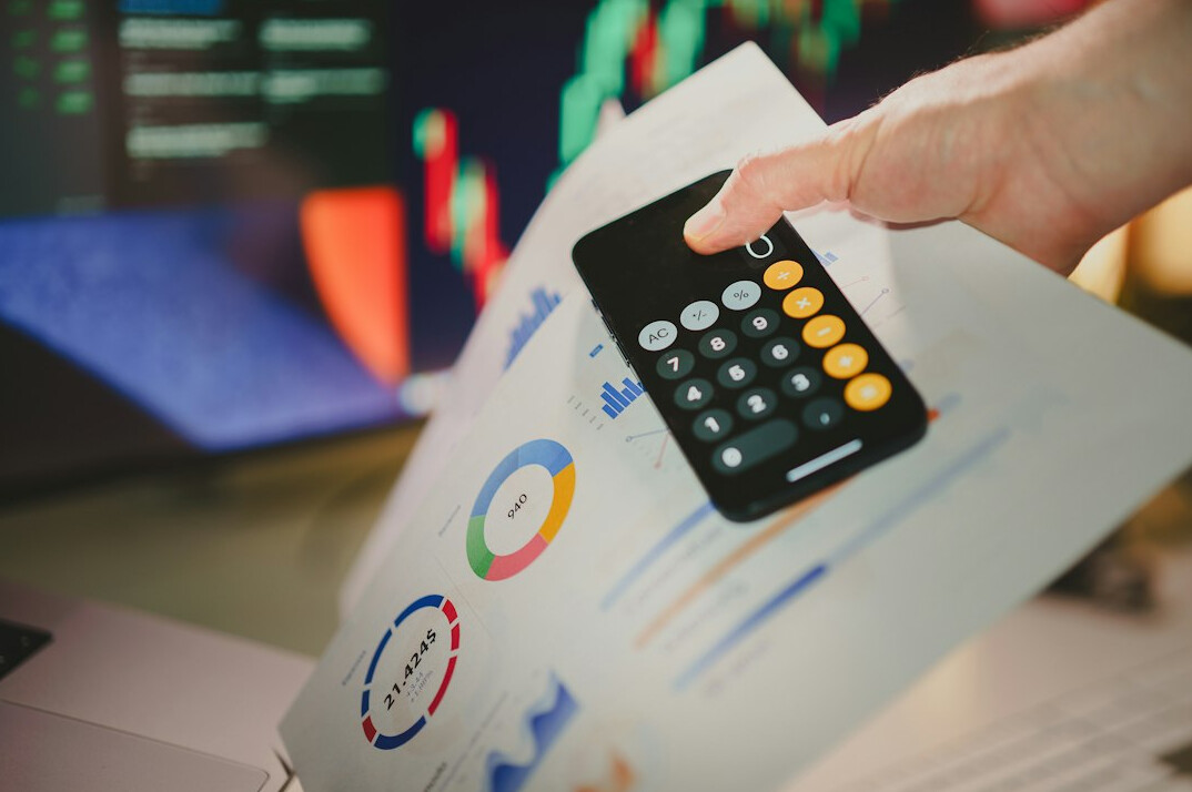 person calculating finances at home